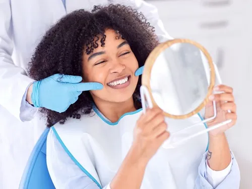 Happy patient smiling in dental chair